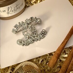 Silver-toned Fashion Jewellery Brooch embellished with rhinestones